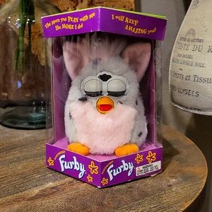 Furby Mint in package. Never opened. Dapple grey with light pink chest